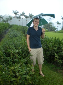 Christopher standing in a tea field